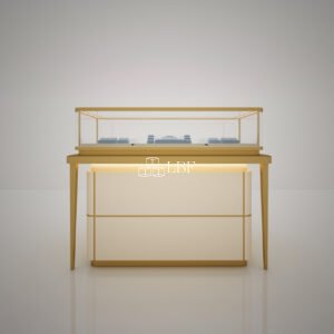 The showcase features a light-luxury design with gold trim frames, paired with high-transmittance tempered glass and built-in warm LED lights to fully reveal the texture of fine jewelry. The enclosed lower storage cabinet offers great practicality. Real-shot photos display its floor-standing layout against shop walls to highlight premium boutique display effects.